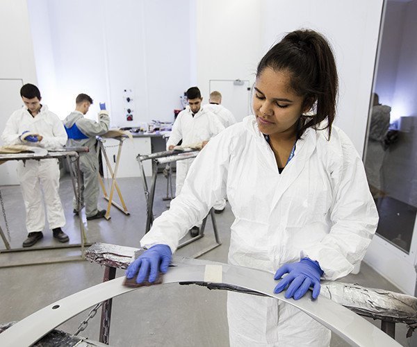 panel apprentices working in workshop